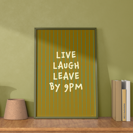 Large "Live, Laugh, Leave by 9 PM" Wall Art Print in green. Framed cute wall decor / entryway artwork next to some books, leaning against light green wall.