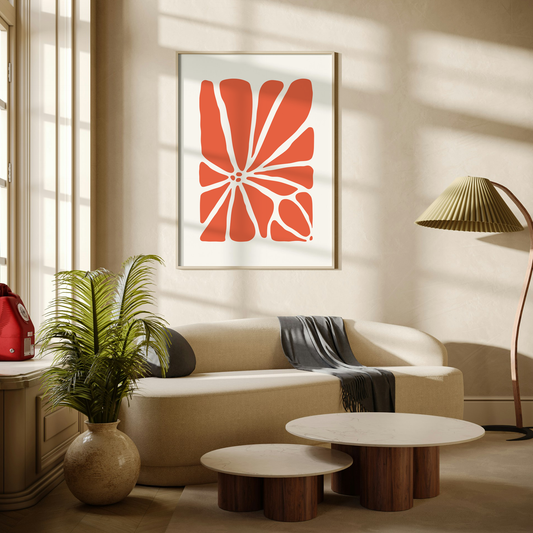 Large Geo Flower Wall Art Print in coral. A modern botanical wall art design, framed and hanging on the wall of a stylish beige living room.