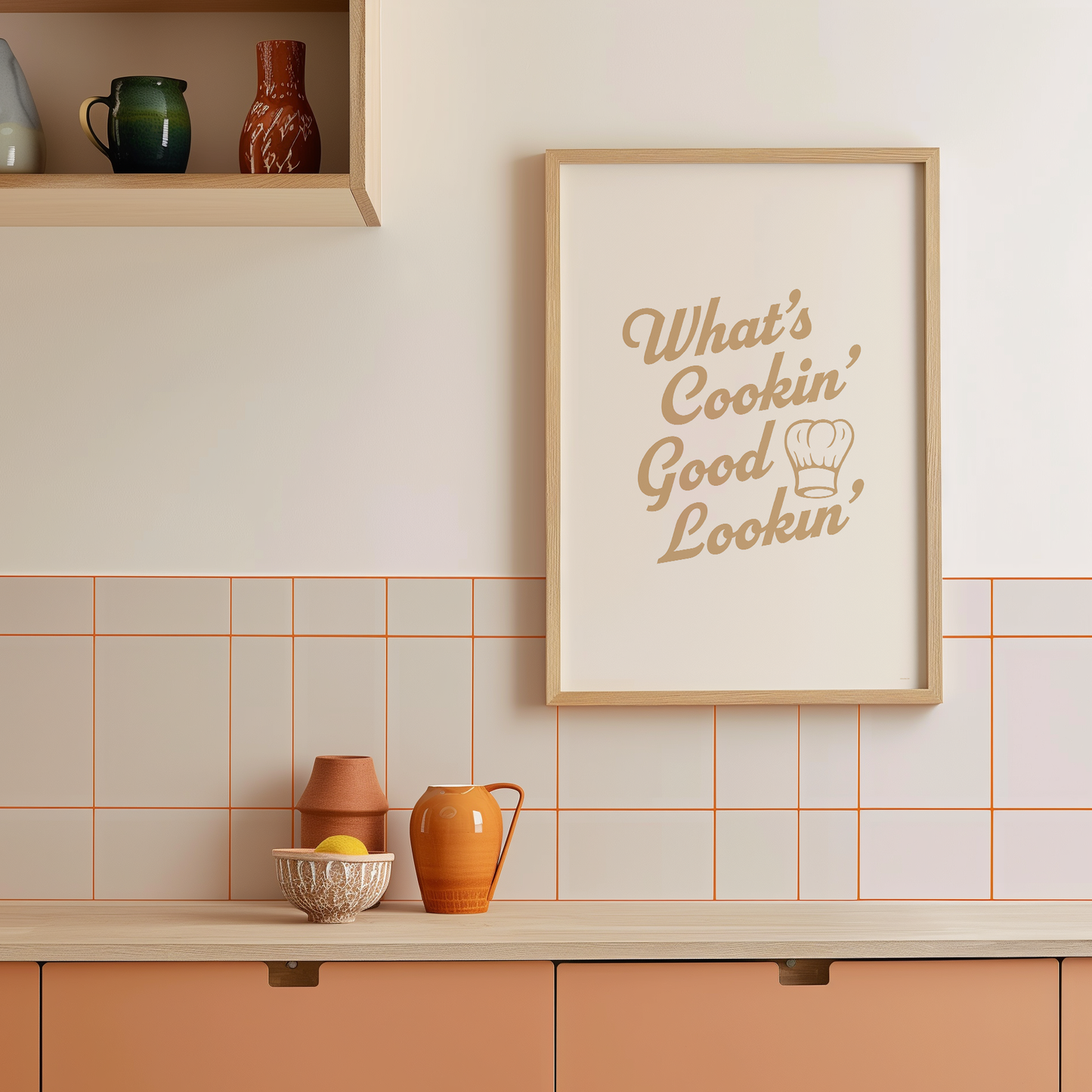 Medium "What's Cookin' Good Lookin'" Kitchen Wall Art Print in Tan on warm off-white background. Framed kitchen wall decor.